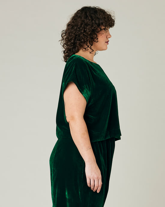 model wears green velvet polly top and mabel trousers