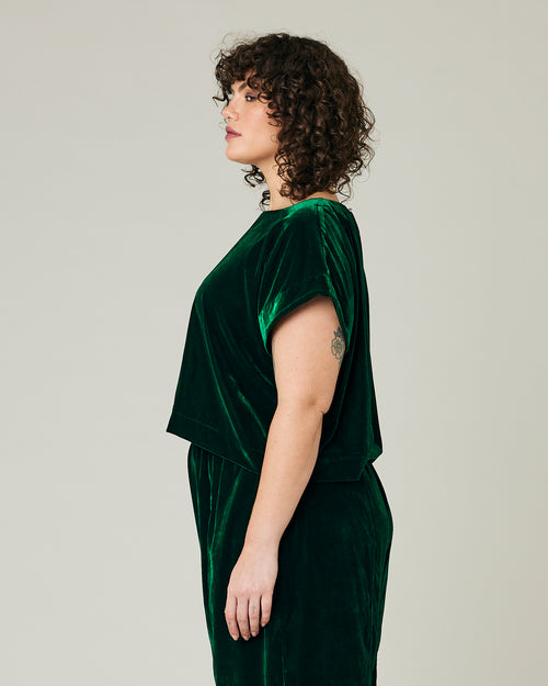 model wears green velvet polly top and mabel trousers