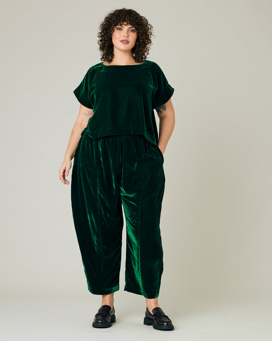 model wears green velvet polly top and mabel trousers