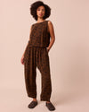 model wears mabel tiger print cupro trousers right