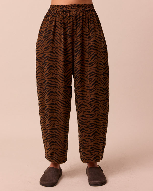 model wears mabel tiger print cupro trousers front