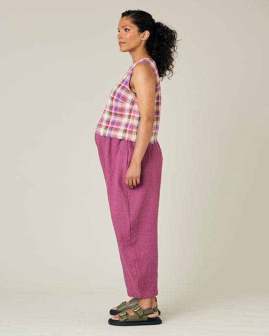 pregnant model wears dahlia pink linen mabel trousers