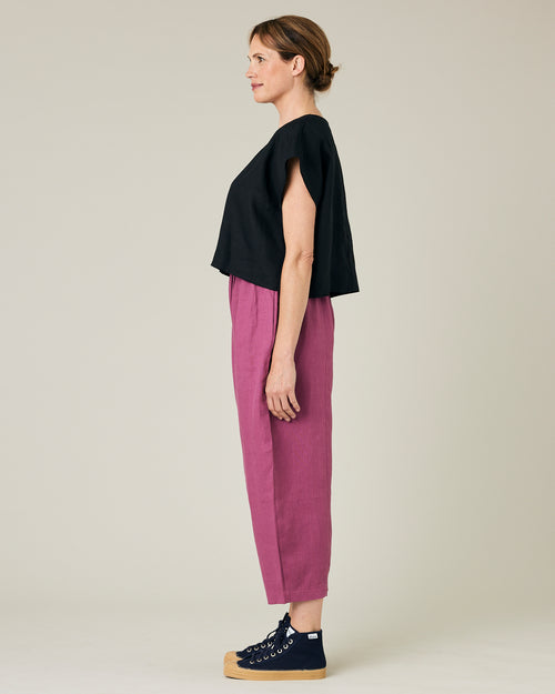 model wears dahlia pink linen mabel trousers