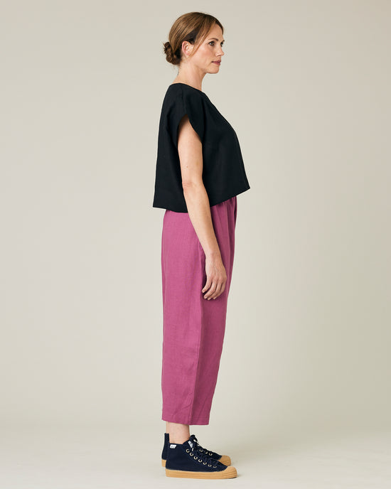 model wears dahlia pink linen mabel trousers