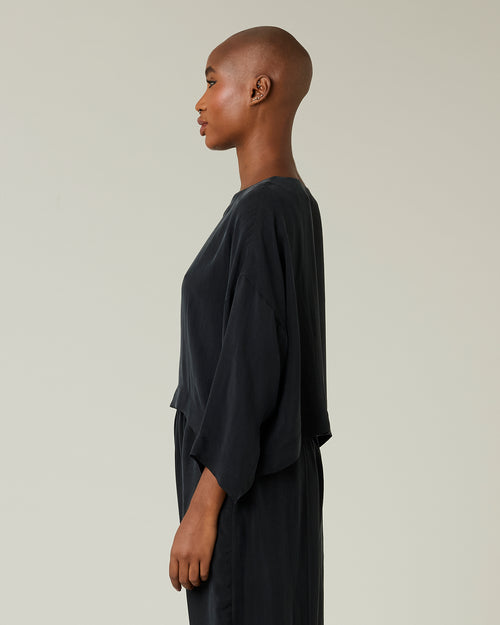 model wears black cupro lily top