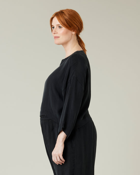 pregnant model wears black cupro lily top