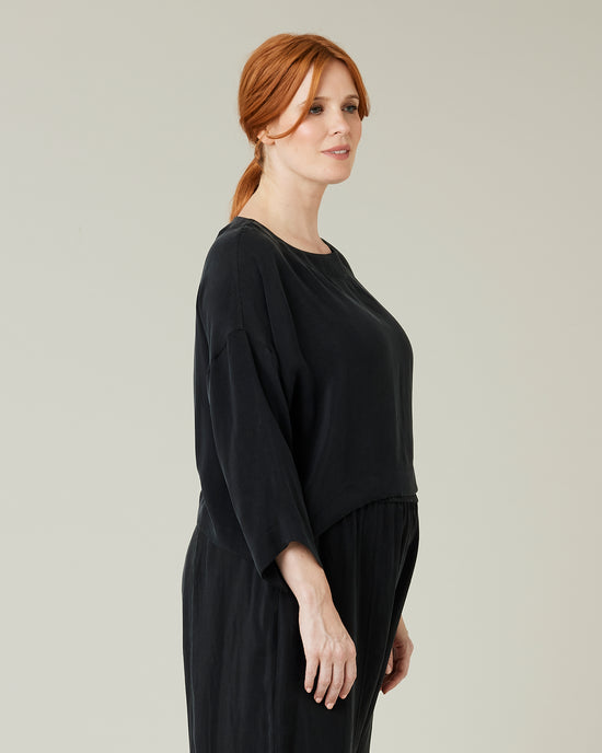 pregnant model wears black cupro lily top