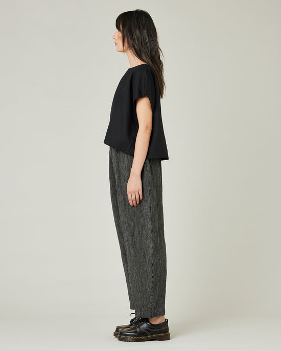 model wears black and ecru pencil stripe linen mabel trousers