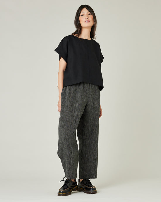 model wears black and ecru pencil stripe linen mabel trousers