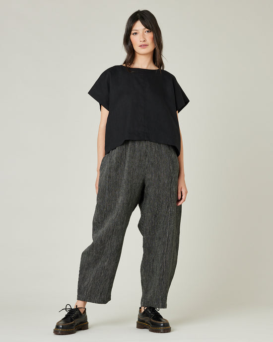 model wears black and ecru pencil stripe linen mabel trousers