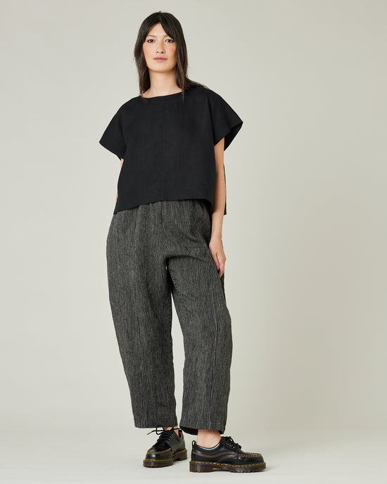 model wears black and ecru pencil stripe linen mabel trousers