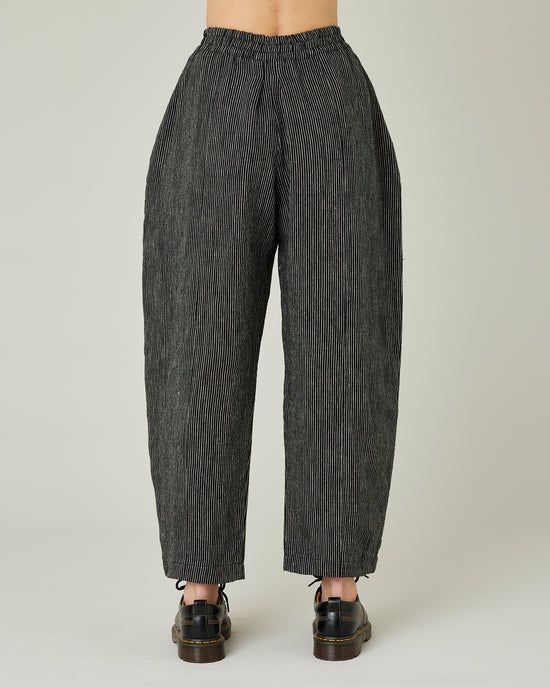 model wears black and ecru pencil stripe linen mabel trousers back