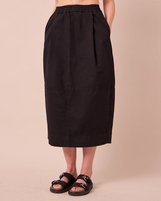 model wears macey black cotton linen skirt
