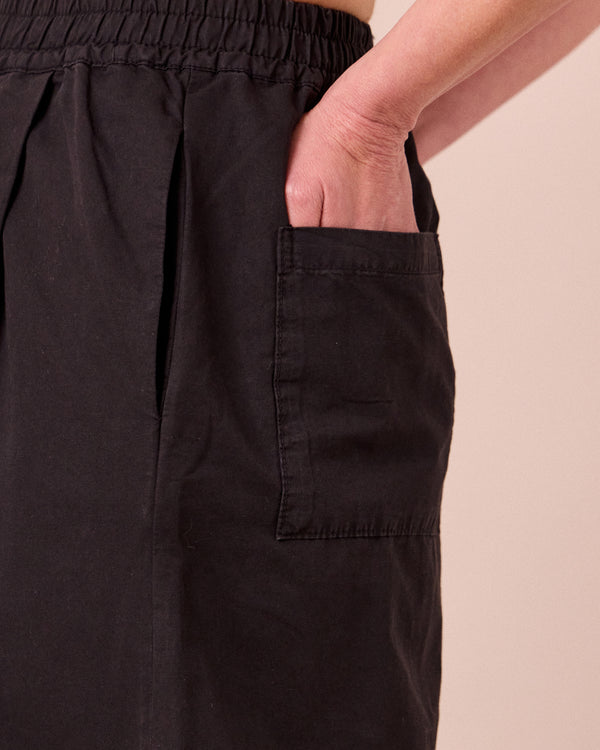 model wears macey black cotton linen skirt