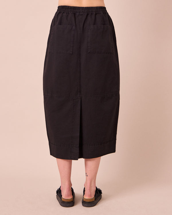 model wears macey black cotton linen skirt