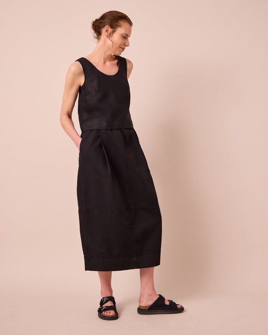 model wears macey black cotton linen skirt