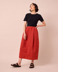 model wears macey brick cotton linen skirt