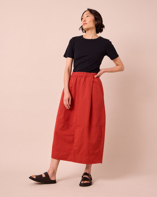 model wears macey brick cotton linen skirt
