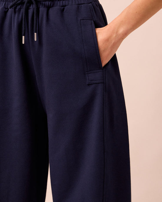 model wears madi ink jersey trousers