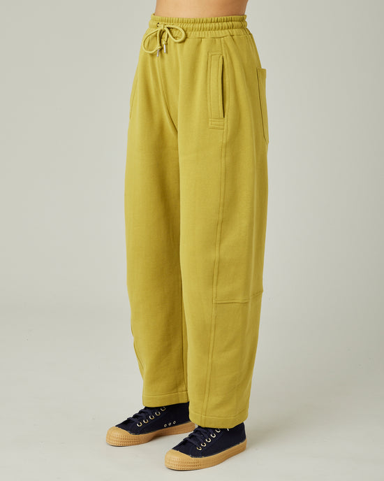 model wears pistachio madi trousers left 