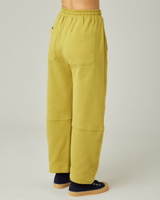 model wears pistachio madi trousers right