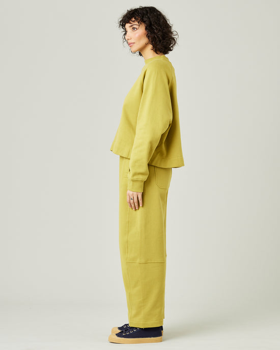 model wears pistachio madi trousers 