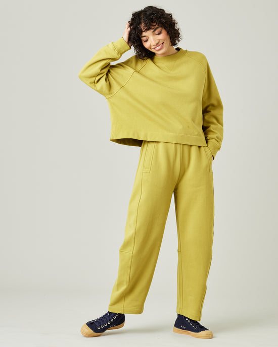 model wears pistachio madi trousers 