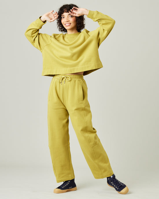 model wears pistachio madi trousers 