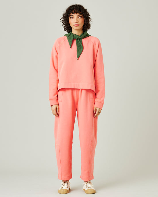 model wears shrimp pink madi trousers 