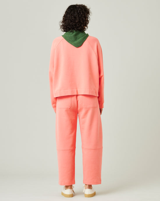 model wears shrimp pink madi trousers 