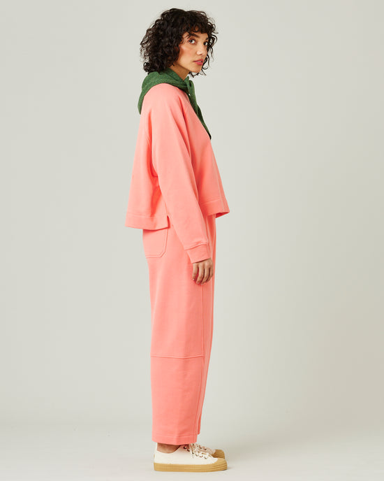 model wears shrimp pink madi trousers 