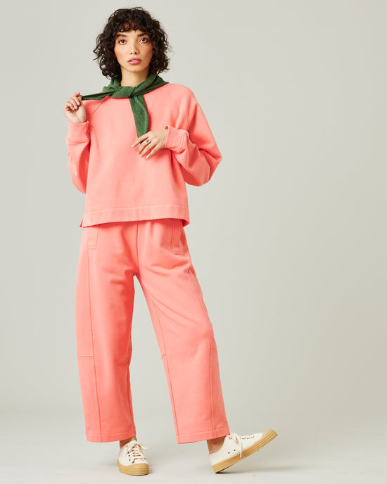 model wears shrimp pink madi trousers 