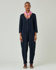 model wears navy margot jersey jumpsuit