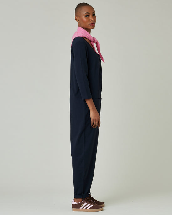 model wears navy margot jersey jumpsuit