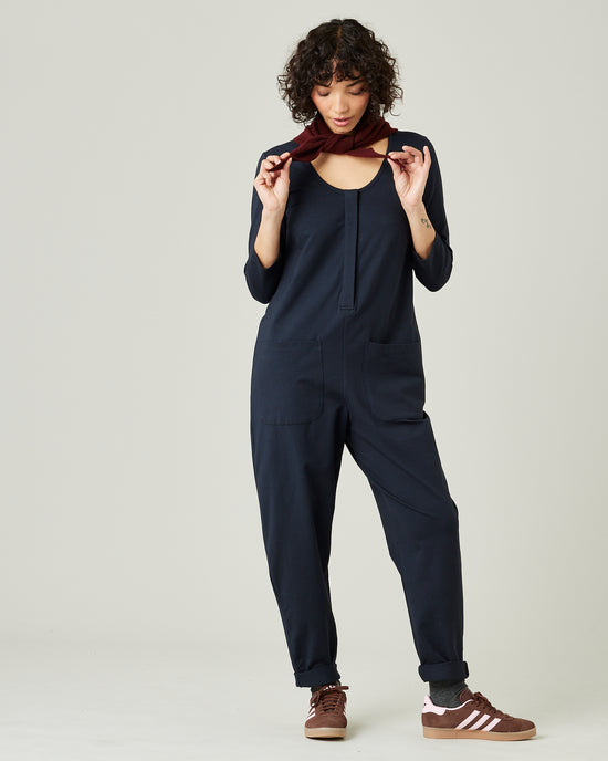 model wears navy margot jersey jumpsuit