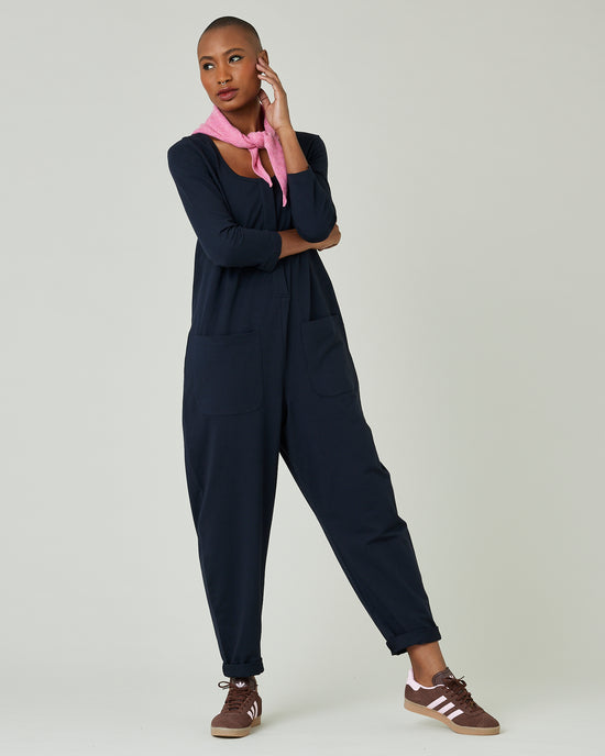 model wears navy margot jersey jumpsuit