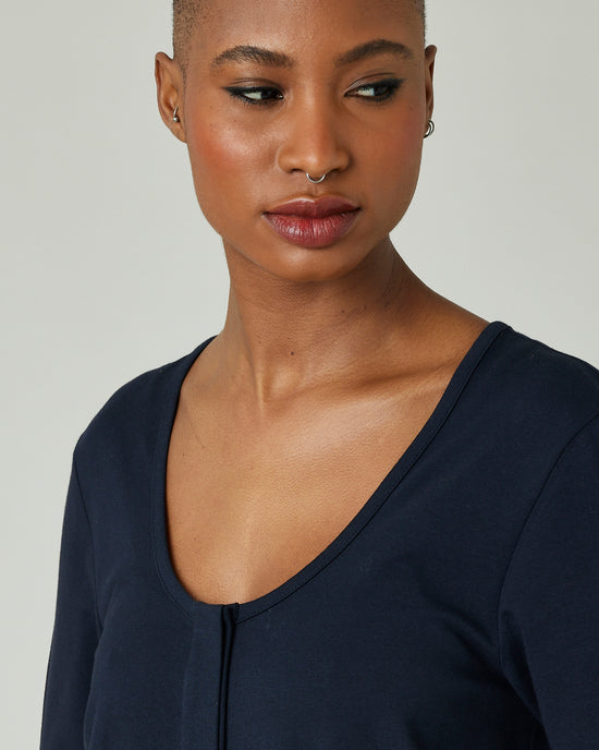 model wears navy margot jersey jumpsuit