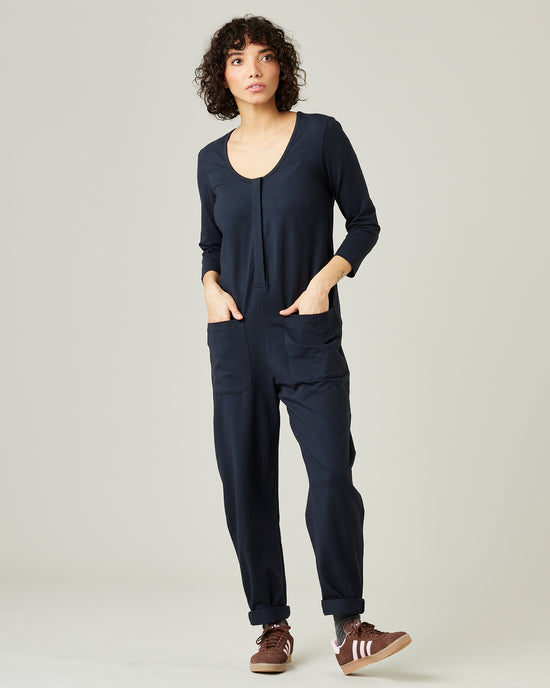 model wears navy margot jersey jumpsuit