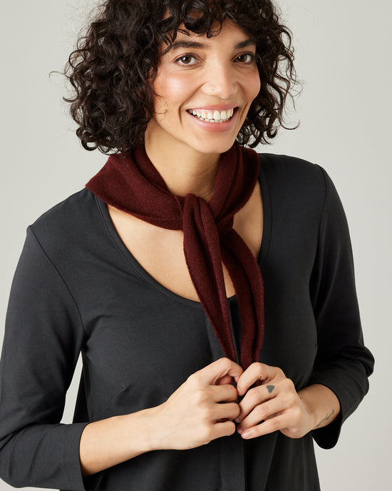 model wears knitted neckerchief in burgundy 