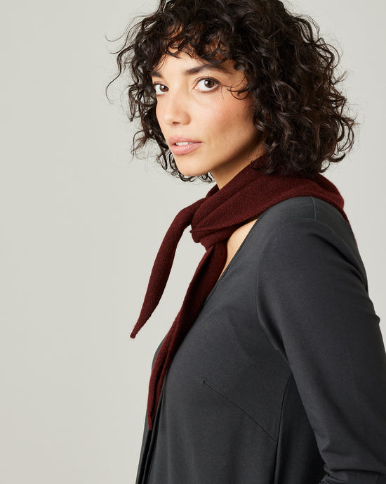 model wears knitted neckerchief in burgundy 