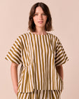 model wears marlow dune stripe poplin top.