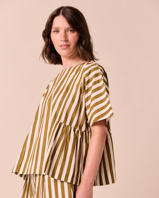 model wears marlow dune stripe poplin top.
