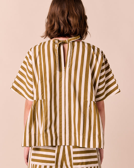 model wears marlow dune stripe poplin top.