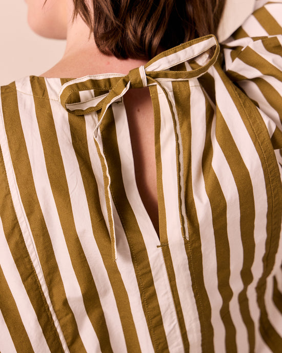 model wears marlow dune stripe poplin top.