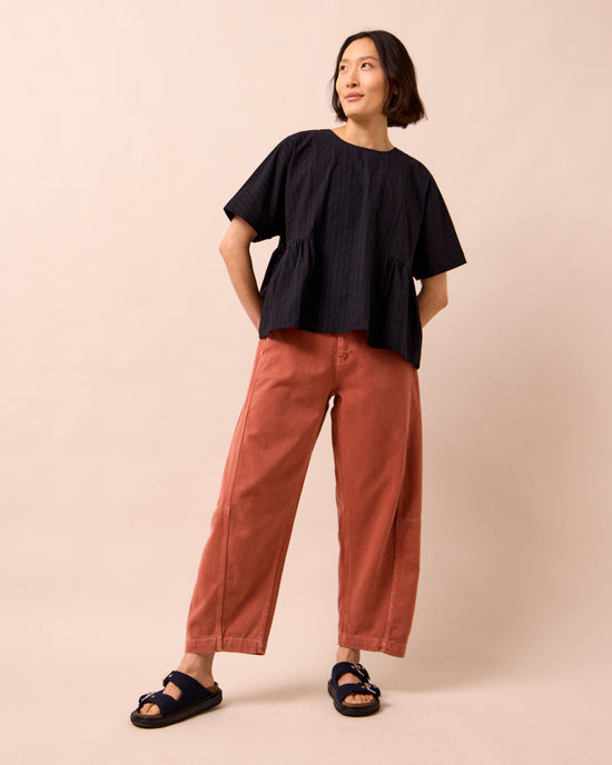 model wears marlow black self stripe cotton top