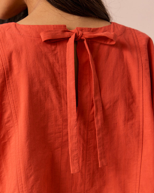 models wears marlow sunblush self stripe cotton top 