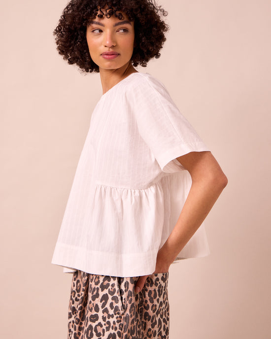 model wears marlow ecru cotton top