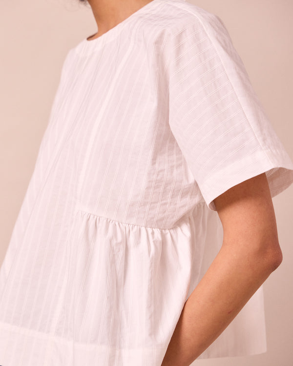 model wears marlow ecru cotton top