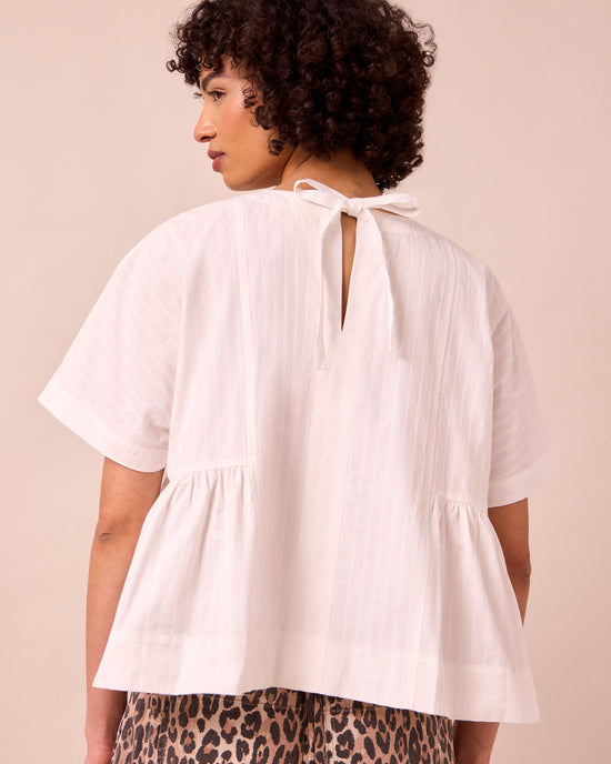 model wears marlow ecru cotton top