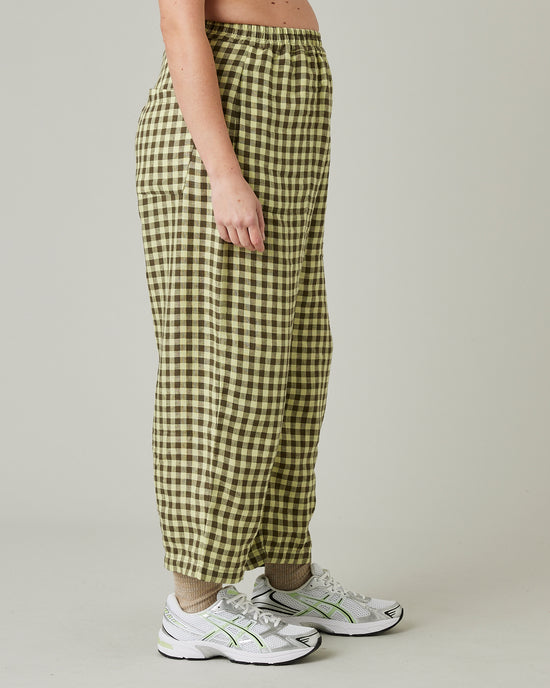 pregnant model wears matcha gingham mabel linen